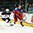 GRAND FORKS, NORTH DAKOTA - APRIL 14: Russia's Klim Kostin #24 skates plays the puck while USA's Luke Martin #2 defends during preliminary round action at the 2016 IIHF Ice Hockey U18 World Championship. (Photo by Minas Panagiotakis/HHOF-IIHF Images)

